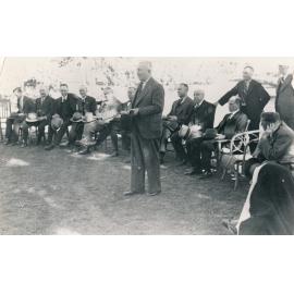 Prime Minister J A Lyons addressing a group of men during his visit to Charters Towers 1938