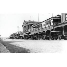 Mining Exchange Hotel, Mosman street with a row of motor cars