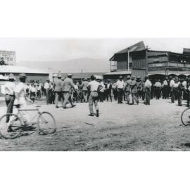 Crowd of men in an unknown street