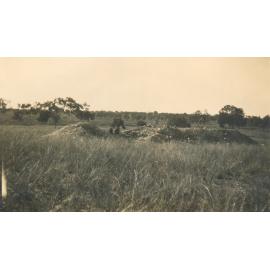 Men prospecting on an old mullock heap