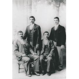 Four men studio portrait