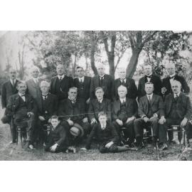Group of men and two boys
