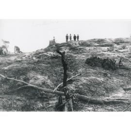 Five men on rocky outcrop