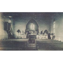 Interior of Church of Christ with May Coward and Robert Williams amongst large group
