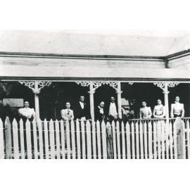 Close up of family on verandah, Dempsey’s House, cnr School and Towers st
