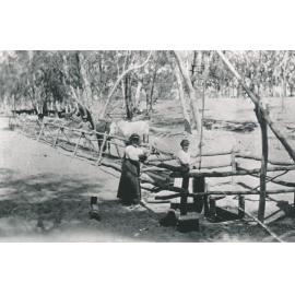 Jack Pryor and Nellie Pryor with sand well
