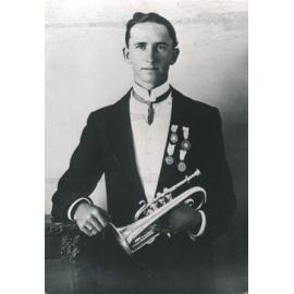 Unknown man holding a cornet