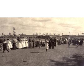 Large crowd around a bush arena