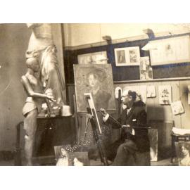 A man painting in an art studio