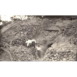Miners at the entrance to a mineshaft or underlie