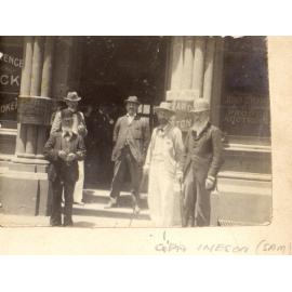 Samuel H Ineson with other men at entrance to large hall