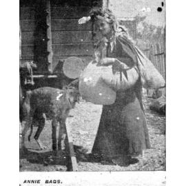 Annie Bags with dog beside railway wagon
