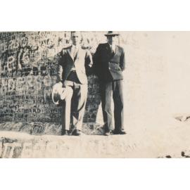 Two men standing at base of the Pyrites Works Chimney, Towers Hill