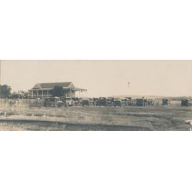 Golf Clubhouse with Motor Vehicles Outside