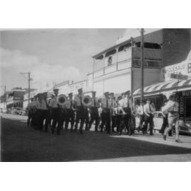Home Hill Band in a marching competition outside Melvin’s Arcade, Gill Street