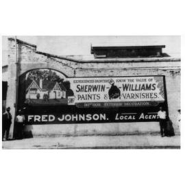 Advertising Sign Outside Fred Johnson’s Hardware Store on the Corner of Elizabeth and Mosman Streets