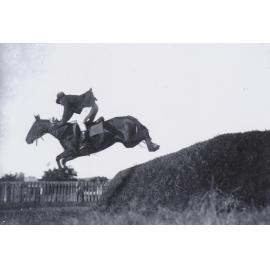 Jim Tolano competing in Show Jumping at the Charters Towers Showgrounds, 1925