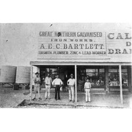 Men Standing in front of Great Northern Galvanised Iron Works, AEC Bartlett