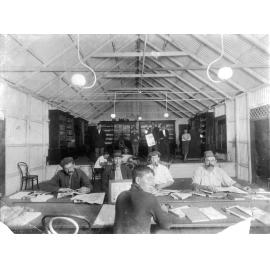 Group of Men in Reading Room