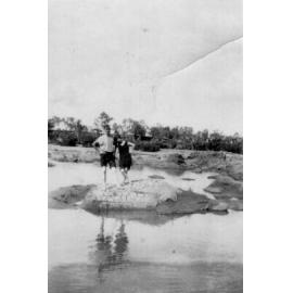 Couple at River in Swimming Costumes