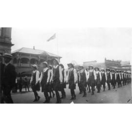 Blackheath College students marching as part of street procession up Gill Street, outside Town Hall