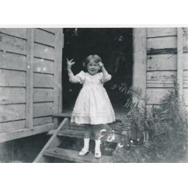 Edna Meredith Wooster on back stairs of Mary Street House
