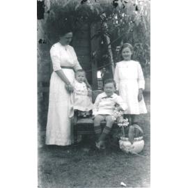 Harriet Wooster with children Edna, Horace and Norma in Backyard