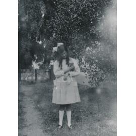 Unknown girl holding a puppy