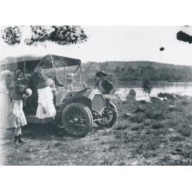 Group of people with Motor Vehicle at Weir