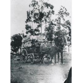 Wagon with load of dressed timber beside rail lines