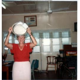 Pam Sellars holding up silver plate